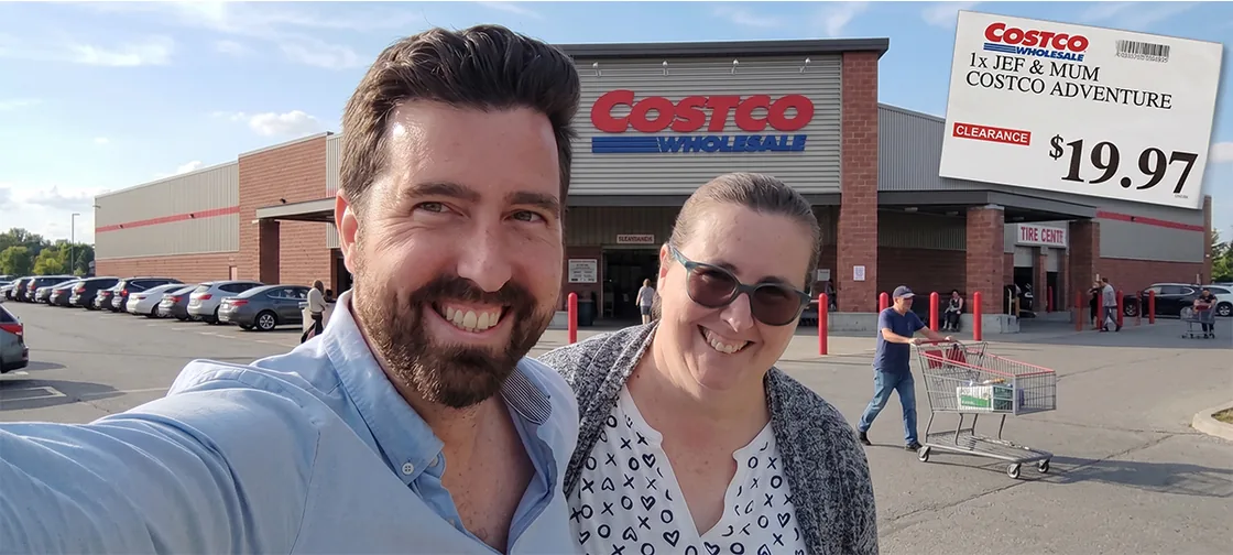 Jef and his mum smiling in the Costco car park, the warehouse behind them, with a
                  mock clearance tag reading 1x JEF & MUM COSTCO ADVENTURE, $19.97.