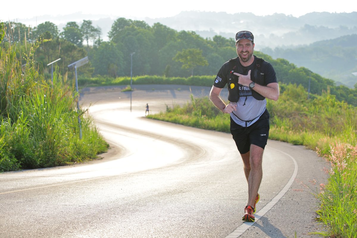 Jef running a hill road at the Khao Kho ultra marathon